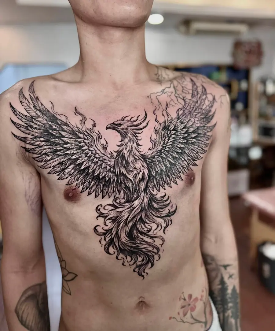 The same blackwork phoenix chest piece seen straight on